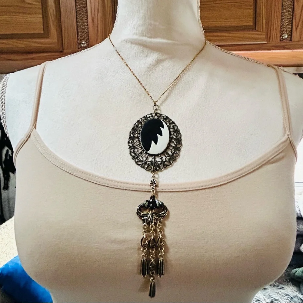 Handcrafted Cruella de Vil cameo bat accent pendant on chain necklace